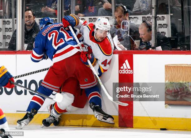 Miles Wood of the New Jersey Devils is checked by Barclay Goodrow of the New York Rangers during the second period at the Prudential Center on...