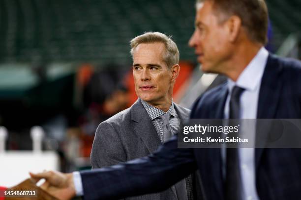 Commentator Joe Buck watches warmups from the field prior to an NFL football game between the Cincinnati Bengals and the Buffalo Bills at Paycor...