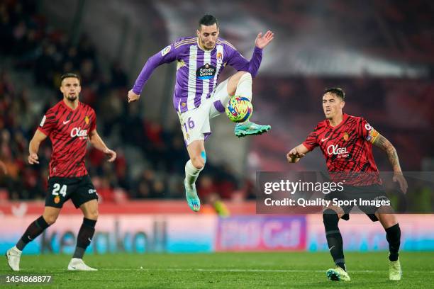 Antonio Raillo of RCD Mallorca competes for the ball with Sergi Guardiola of Real Valladolid CF during the La Liga Santander match between RCD...