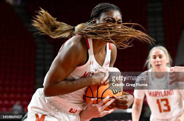 Diamond Miller of the Maryland Terrapins battles for the ball in the third quarter against Julia Ayrault of the Michigan State Spartans at Xfinity...