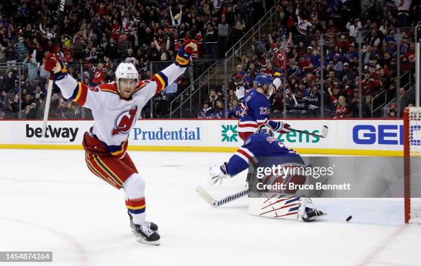 Damon Severson of the New Jersey Devils scores the game-winning goal at 2:47 of overtime against Igor Shesterkin of the New York Rangers at the...