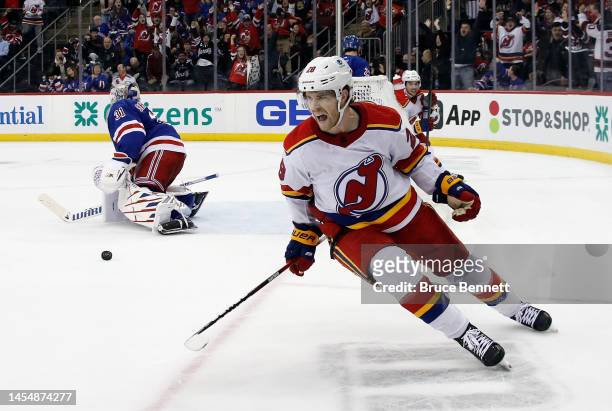 Damon Severson of the New Jersey Devils celebrates his game-winning goal at 2:47 of overtime against Igor Shesterkin of the New York Rangers at the...