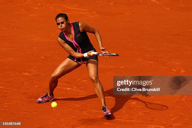 Stephanie Foretz Gacon of France plays a forehand in her women's singles second round match against Na Li of China during day 5 of the French Open at...