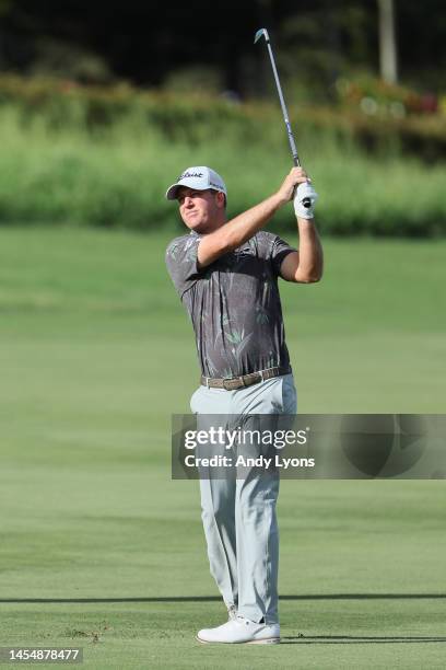 Tom Hoge of the United States plays a second shot on the third hole during the third round of the Sentry Tournament of Champions at Plantation Course...