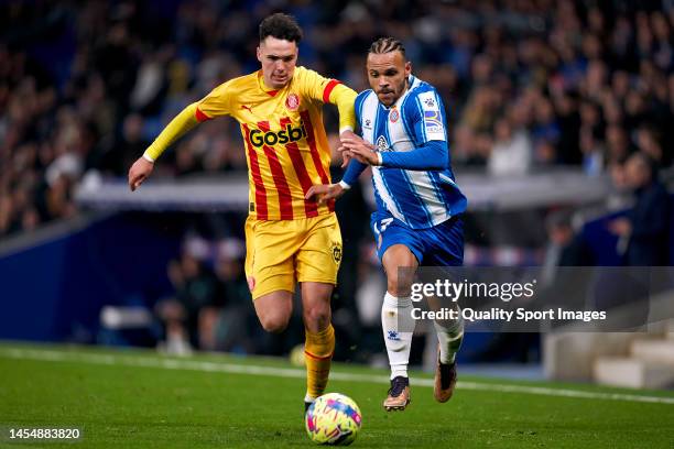 Arnau Martinez of Girona FC compete for the ball with Martin Braithwaite of RCD Espanyol during the LaLiga Santander match between RCD Espanyol and...