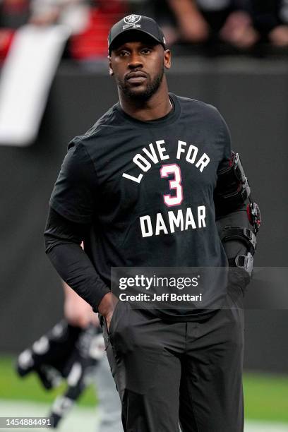 Chandler Jones of the Las Vegas Raiders wears a shirt in honor of Damar Hamlin of the Buffalo Bills during warmups prior to a game against the Kansas...
