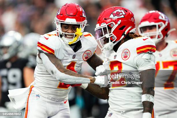 Ronald Jones of the Kansas City Chiefs celebrates with teammate Jerick McKinnon after scoring a touchdown against the Las Vegas Raiders during the...