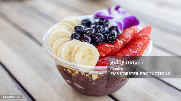 healthy food in a bowl on table - acai stock-fotos und bilder