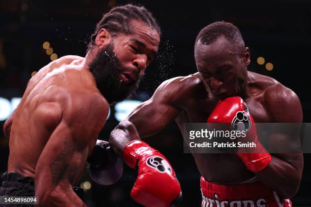 Lamont Peterson is punched by Michael Ogundo in their Super Lightweight bout at Capital One Arena on January 7, 2023 in Washington, DC.