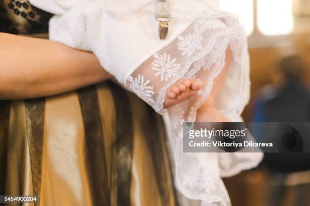 photo of  baby feet in a blanket - baptism girl stock pictures, royalty-free photos & images