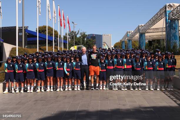 Craig Tiley, CEO of Tennis Australia and Denis Shapovalov of Canada pose with 2023 Australian Open ballkids during a media opportunity ahead of the...