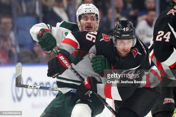 Ilya Lyubushkin of the Buffalo Sabres collides with Sam Steel of the Minnesota Wild during the first period of an NHL hockey game at KeyBank Center...