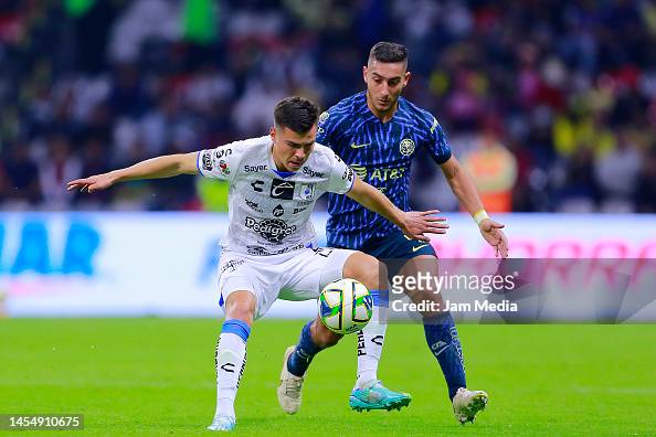 Ettson Ayon of Queretaro fights for the ball with Sebastian Caceres ...