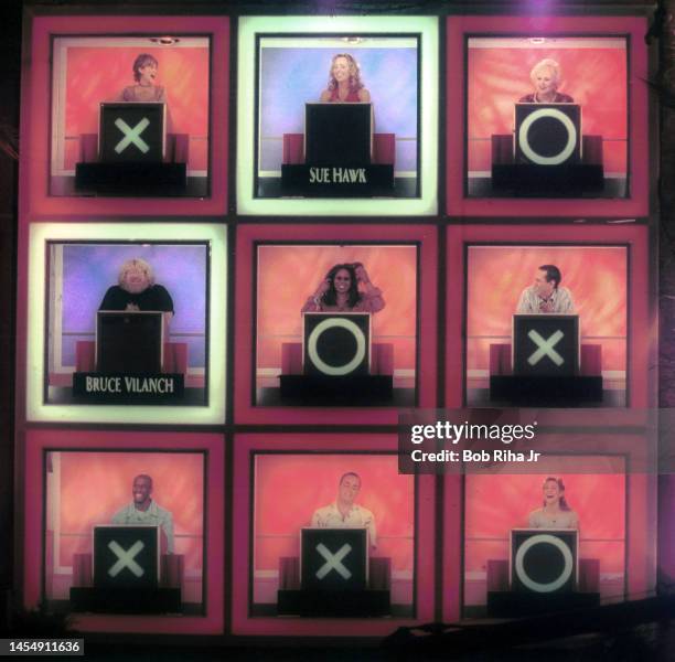 Survivor' tv show winner Richard Hatch sits below Whoopi Goldberg during taping of 'Hollywood Squares, August 26, 2000 in Los Angeles, California....