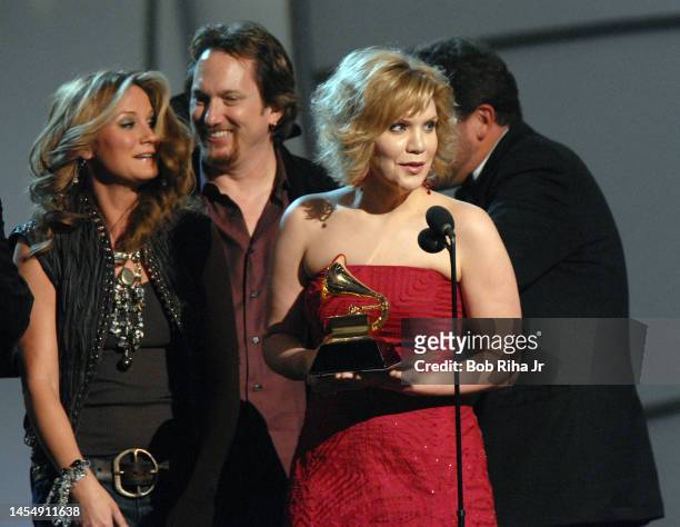 Country Singer Alison Krauss accepts Award with Jerry Douglas and Dan Tyminski of 'Union Station' with presenter Jennifer Nettles at Grammy Awards,...