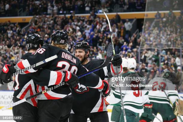 Rasmus Dahlin, Victor Olofsson, and Tyson Jost of the Buffalo Sabres celebrate after a goal by Dahlin during the second period of an NHL hockey game...