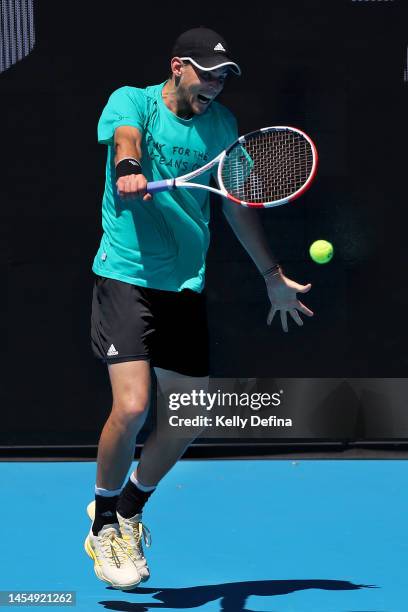 Dominic Thiem of Austria plays a backhand during a practice session ahead of the 2023 Australian Open at Melbourne Park on January 08, 2023 in...