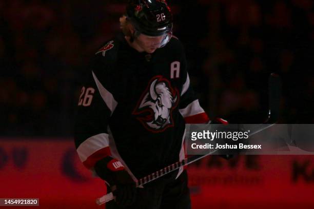 Rasmus Dahlin of the Buffalo Sabres stands during player introductions before an NHL hockey game against the Minnesota Wild at KeyBank Center on...