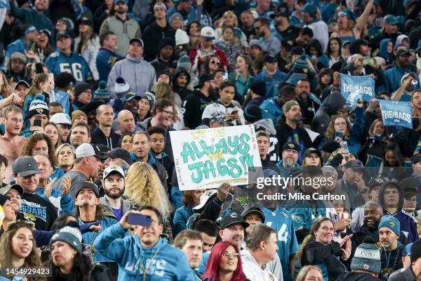 Jacksonville Jaguars fan holds up a sign during a game against the Tennessee Titans at TIAA Bank Field on January 07, 2023 in Jacksonville, Florida.