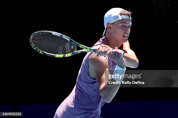 Holger Rune of Denmark plays a backhand during a practice session ahead of the 2023 Australian Open at Melbourne Park on January 08, 2023 in...