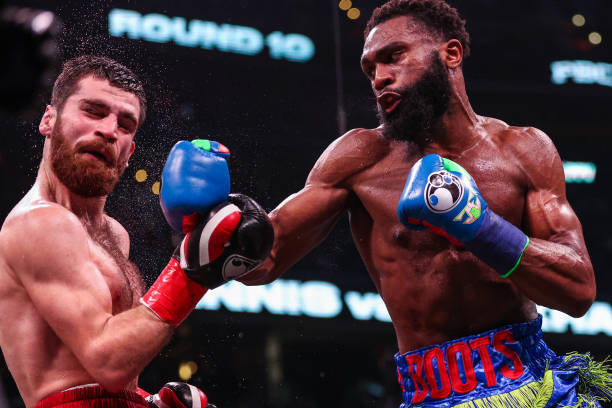 Jaron Ennis punches Karen Chukhadzhian in their Interim IBF Welterweight Championship bout at Capital One Arena on January 7, 2023 in Washington, DC.