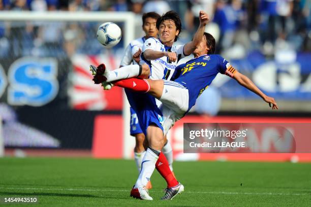 Yasuhito Endo of Gamba Osaka and Shunsuke Nakamura of Yokohama F.Marinos compete for the ball during the J.League J1 match between Yokohama F.Marinos...