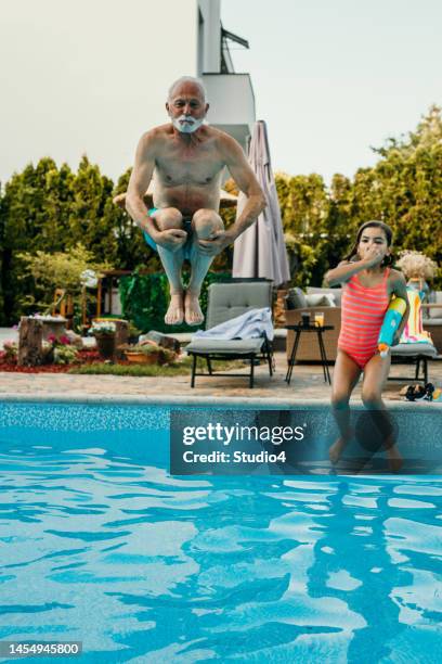 extended family pool time - family time stock pictures, royalty-free photos & images