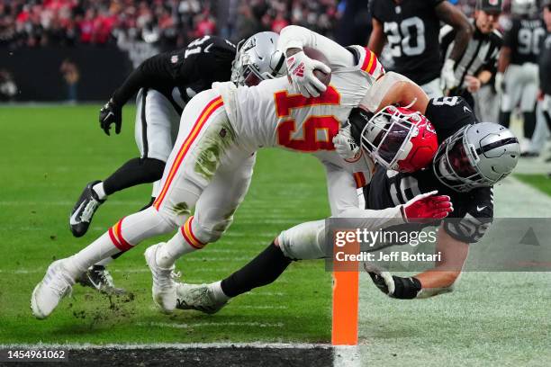 Wide receiver Kadarius Toney of the Kansas City Chiefs catches a touchdown against linebacker Luke Masterson of the Las Vegas Raiders during the...