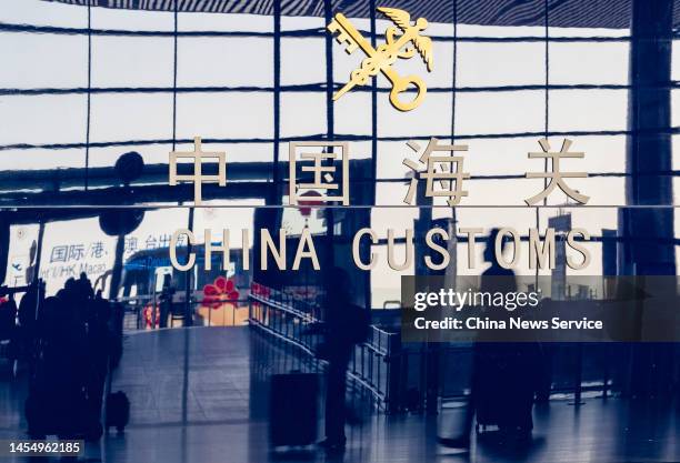 An emblem of China Customs is seen at Beijing Capital International Airport as China lifts quarantine requirements for international arrivals on...