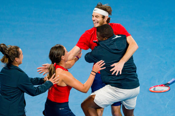 Taylor Fritz of the United States celebrates with Team USA after winning championship point in his final match against Matteo Berrettini of Italy...