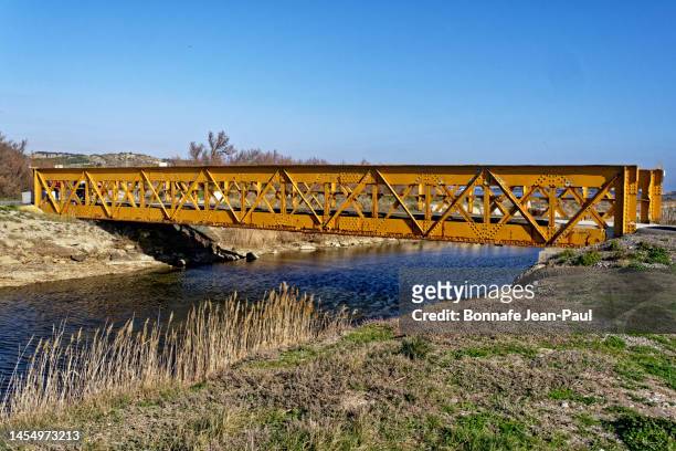 old metal bridge painted yellow - narbona fotografías e imágenes de stock