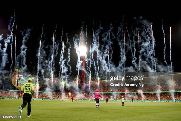 Pyrotechnics are seen during the Men's Big Bash League match between the Sydney Thunder and the Sydney Sixers at Sydney Showground Stadium, on...