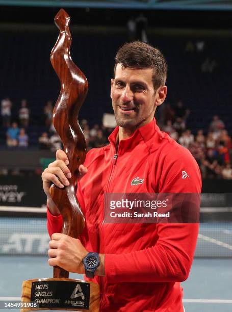 Novak Djokovic of Serbia wins the mens championship after defeating Sebastian Korda of the USA with his coaching staff during day eight of the 2023...
