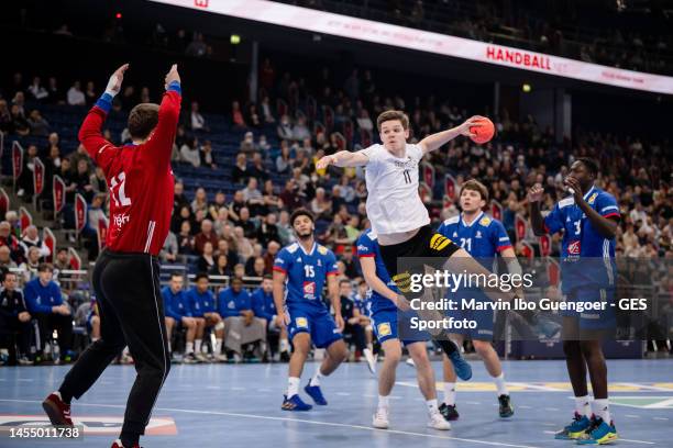 Felix Eissing of Germany throws a ball against Quentin Hulot of France during the U21 handball international friendly match between Germany and...