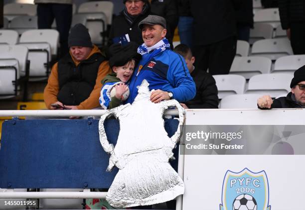 Hartlepool United fans display a tin foil FA Cup prior to the Emirates FA Cup Third Round match between Hartlepool United and Stoke City at Suit...