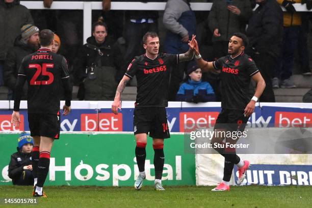 Josh Tymon and Jacob Brown of Stoke City celebrate the team's first goal, an own goal scored by Euan Murray of Hartlepool United during the Emirates...