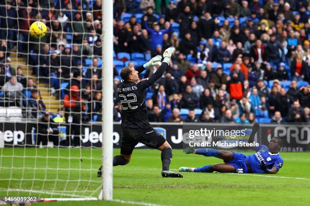 Sheyi Ojo of Cardiff City scores the team's second goal past Joel Robles of Leeds United during the Emirates FA Cup Third Round match between Cardiff...
