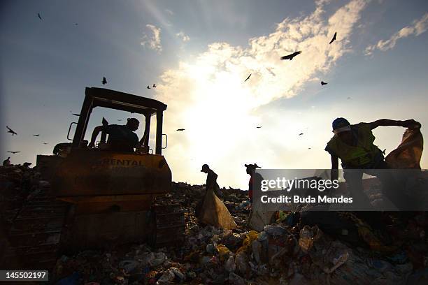 Rubbish collectors at Jardim Gramacho, the biggest open air garbage dump in Latin American on its closing day on May 31, 2012 in Rio de Janeiro,...