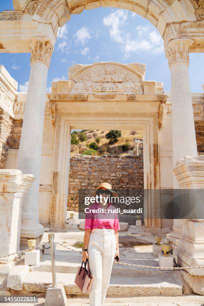 tourist senior woman enjoy exploring the ancient city of ephesus, - izmir stockfoto's en -beelden
