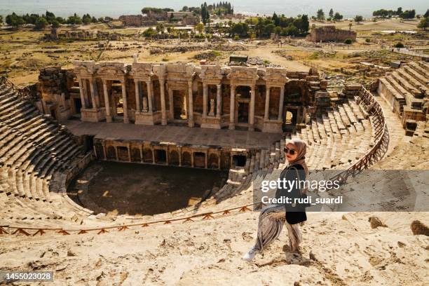 asian muslim woman traveling and enjoy the summer holiday at pamukkale - hierapolis stock pictures, royalty-free photos & images