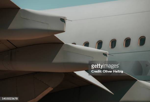 close up of a commercial passenger air jet plane - flugzeugrumpf stock-fotos und bilder