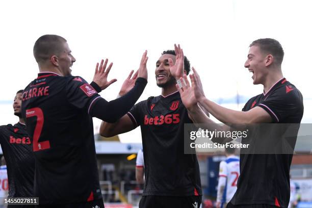 Liam Delap, Jacob Brown and Harry Clarke of Stoke City celebrate the team's third goal, an own goal scored by Rollin Menayese during the Emirates FA...