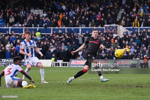 Liam Delap of Stoke City looks to shoot as Rollin Menayese of Hartlepool United scores an own goal for the Stoke City third goal during the Emirates...