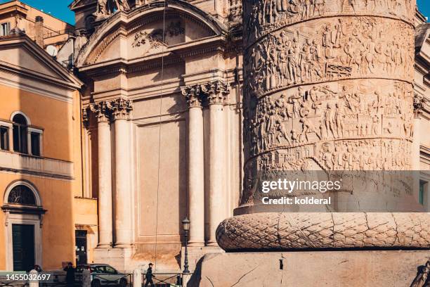 ancient rome at sunset. closeup of trajan’s column on foreground. - trajan's forum stock-fotos und bilder