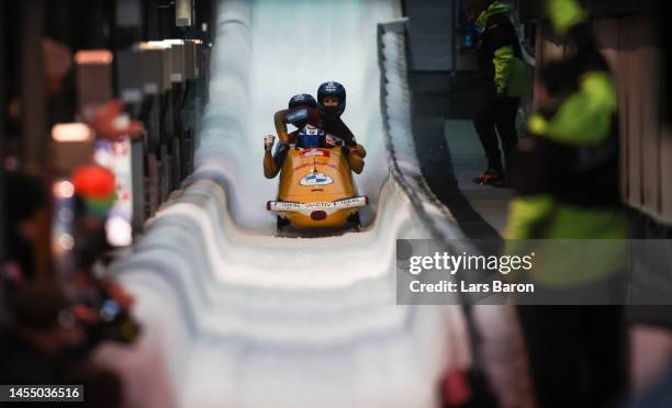 Francesco Friedrich, Thorsten Margis, Candy Bauer and Alexander Schueller celebrate after winning the 4-man Bobsleigh during the BMW IBSF Skeleton...