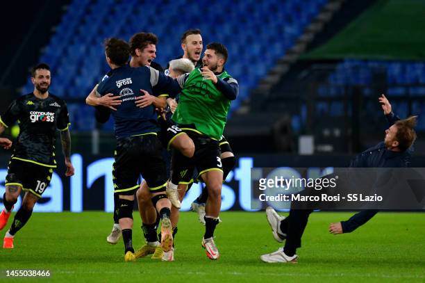 Răzvan Gabriel Marin of Empoli FC celebrates scoring his team's second goal, a late equaliser, with his team-mates during the Serie A match between...