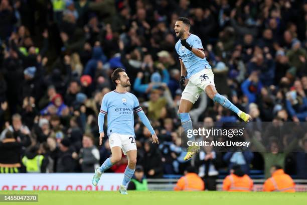 Riyad Mahrez of Manchester City celebrates after scoring the team's first goal during the Emirates FA Cup Third Round match between Manchester City...