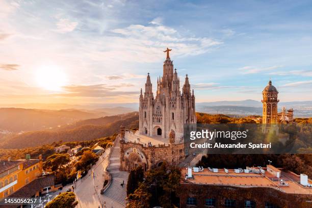 tibidabo mountain and sagrat cor church at sunset, barcelona, spain - barcelona spain stock pictures, royalty-free photos & images