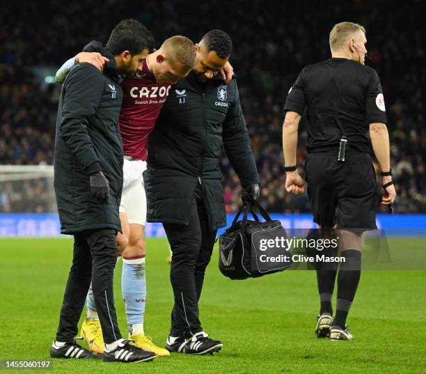 Ludwig Augustinsson of Aston Villa leaves the field after suffering an injury during the Emirates FA Cup Third Round match between Aston Villa and...
