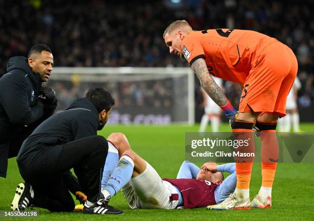 Ludwig Augustinsson of Aston Villa reacts as they receive medical treatment during the Emirates FA Cup Third Round match between Aston Villa and...